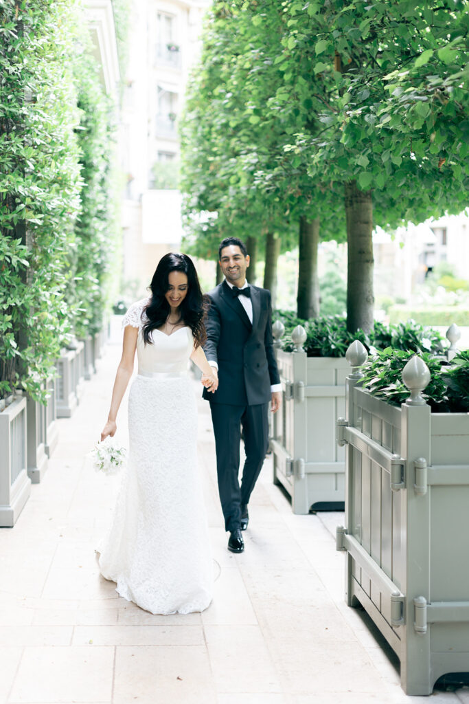 Wedding photograph of bride and groom outside Ritz Paris