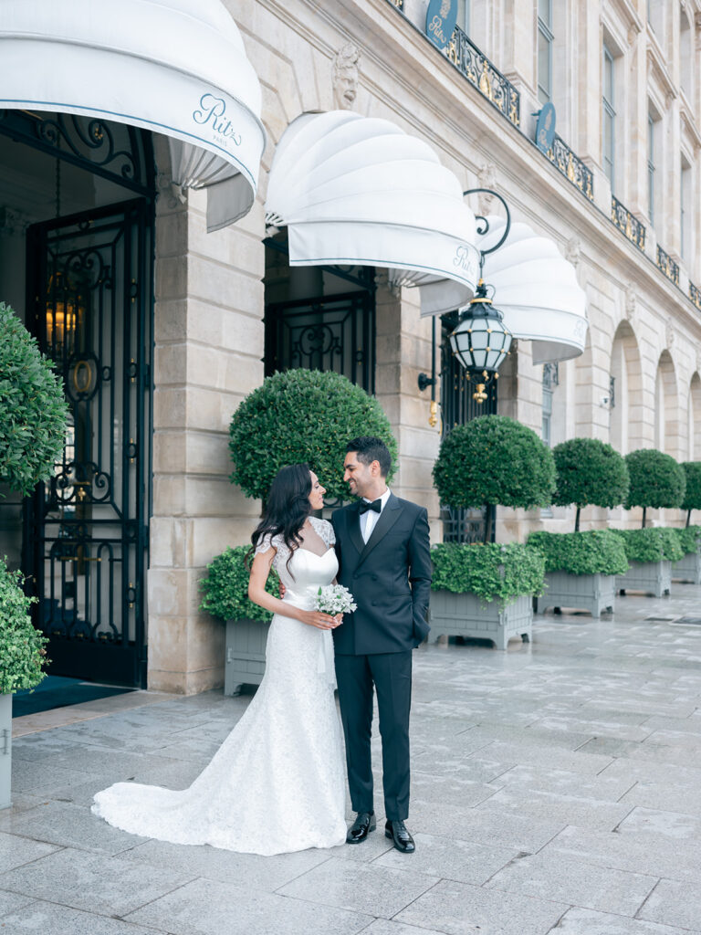 Wedding photograph of a married couple in front of Ritz Paris